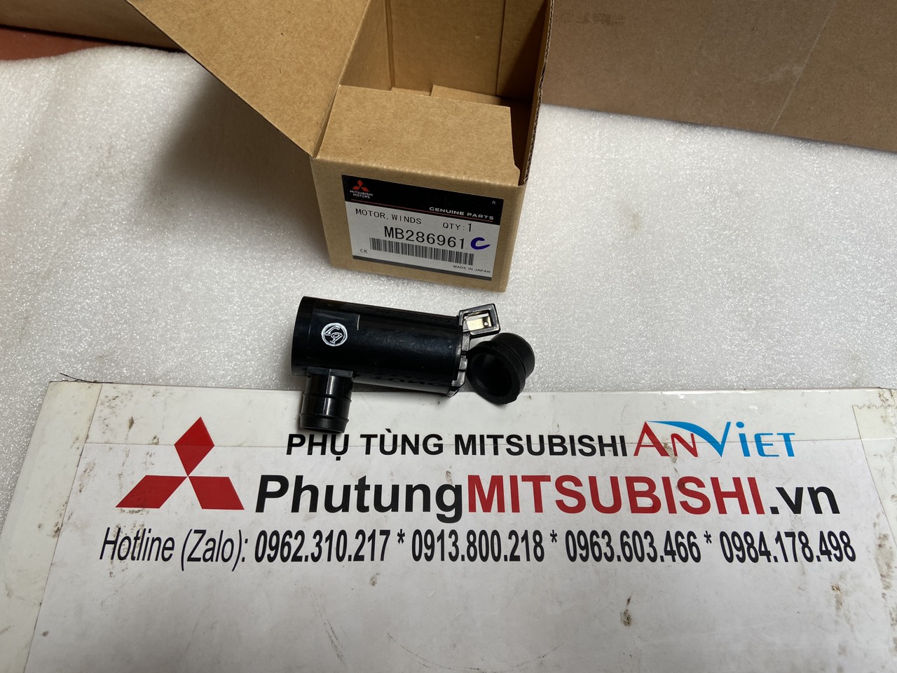 Mô tơ bơm nước rửa kính xe Mitsubishi Lancer