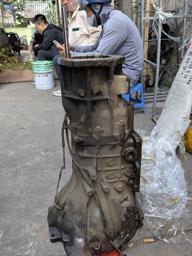 Bãi 3242A036 Hộp số chính xe số sàn  Mitsubishi Triton máy xăng ka50 kb50 kk4t Kl4t , Zinger vc4 = 5FMt=xe 2 cầu 4wd V5M21-J-GGT,GGG,GGR