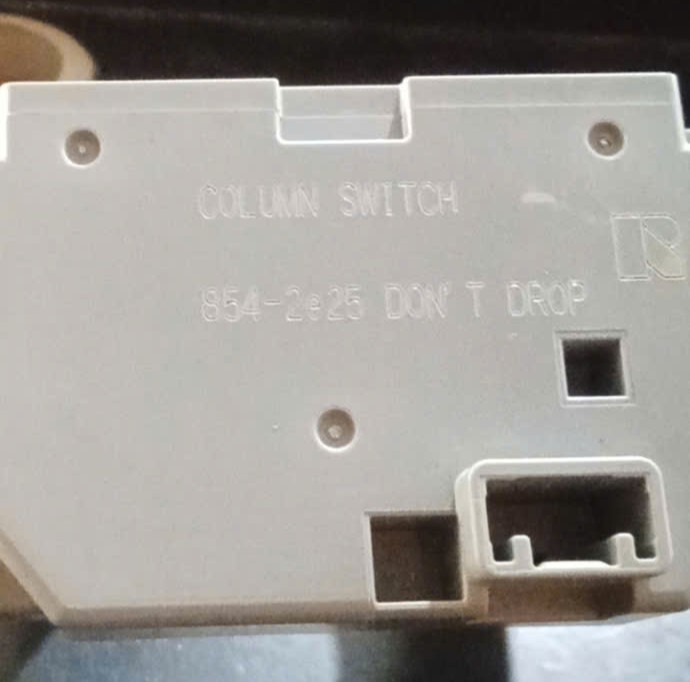 Cảm biến góc lái màu xám ghi Mitsubishi Triton 2016 2023 dưới cáp còi cuộn kèn vô lăng  ở cụm công tắc pha cốt và gạt mưa mã: 854-2e25  8600A764  8617a574 xịn k vỏ