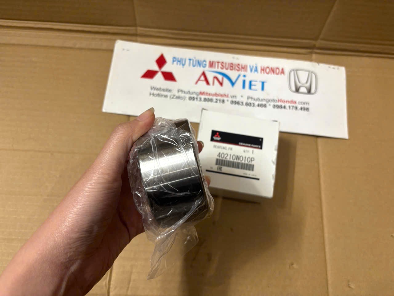 Bi moay ơ trước xe Mitsubishi Xforce 40210W010P 3885A040